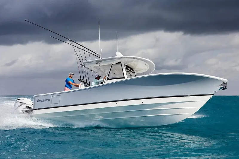 Slide: The Image of Manufacturer Provided Image: 2026 Regulator 31 boat cruising on ocean under cloudy sky. - 57