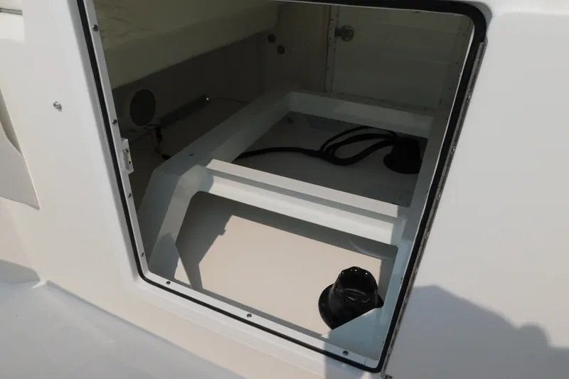 Slide: The Image of Open storage compartment on a 2026 Regulator 31 boat, showcasing interior details. - 28