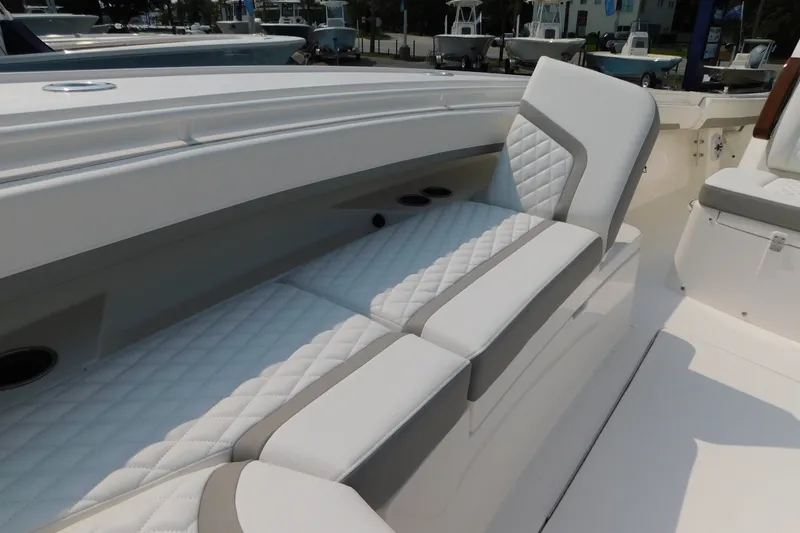 Slide: The Image of 2026 Regulator 31 boat interior with white quilted seating and modern design. - 29
