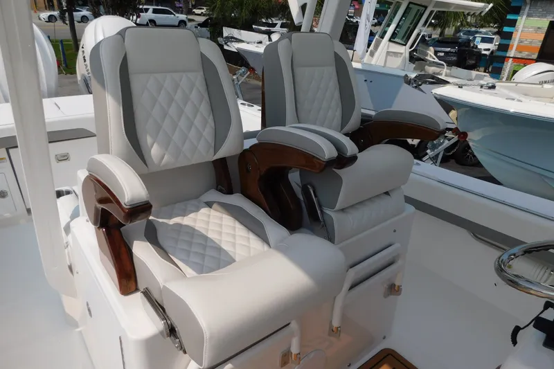 Slide: The Image of Luxurious seating on a 2026 Regulator 31 boat, featuring plush, diamond-stitched upholstery. - 5