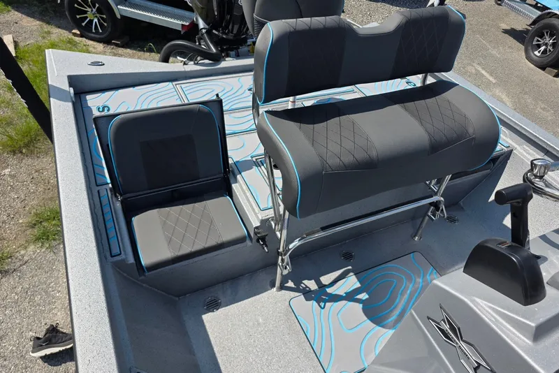Slide: The Image of 2027 Xpress H20B Bay boat interior with modern seating and sleek design. - 13