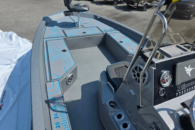 Slide: The Image of 2027 Xpress H20B Bay boat interior with modern console and seating. - 7
