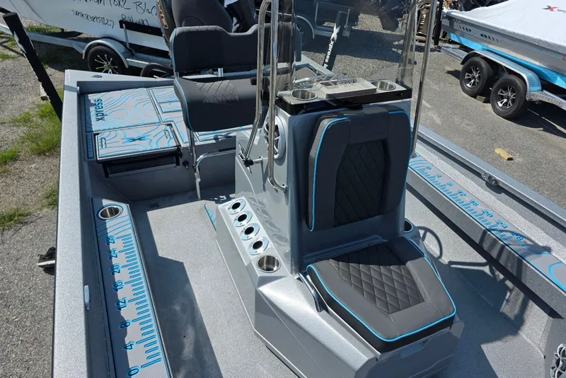Slide: The Image of 2027 Xpress H20B Bay boat interior with seating and measurement markings. - 11