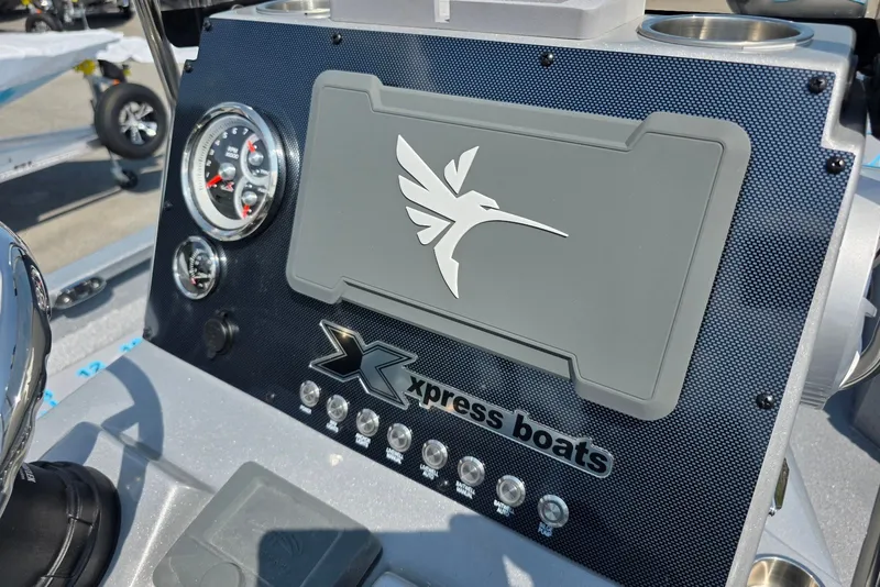Slide: The Image of Dashboard of 2027 Xpress H20B Bay boat with logo and gauges. - 15