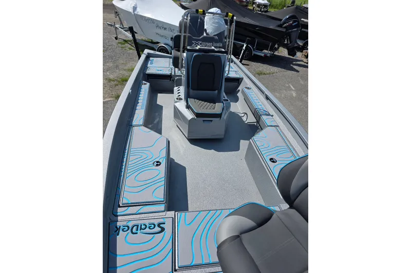 Slide: The Image of 2027 Xpress H20B Bay boat interior with stylish seating and SeaDek flooring. - 10