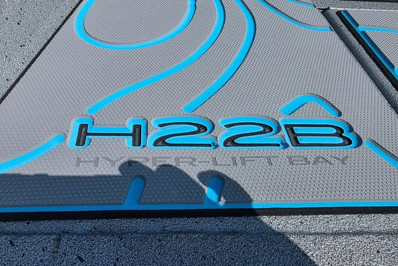 Slide: The Image of Close-up of Xpress H20B Bay 2027 boat deck with H22B Hyper-Lift Bay logo. - 8