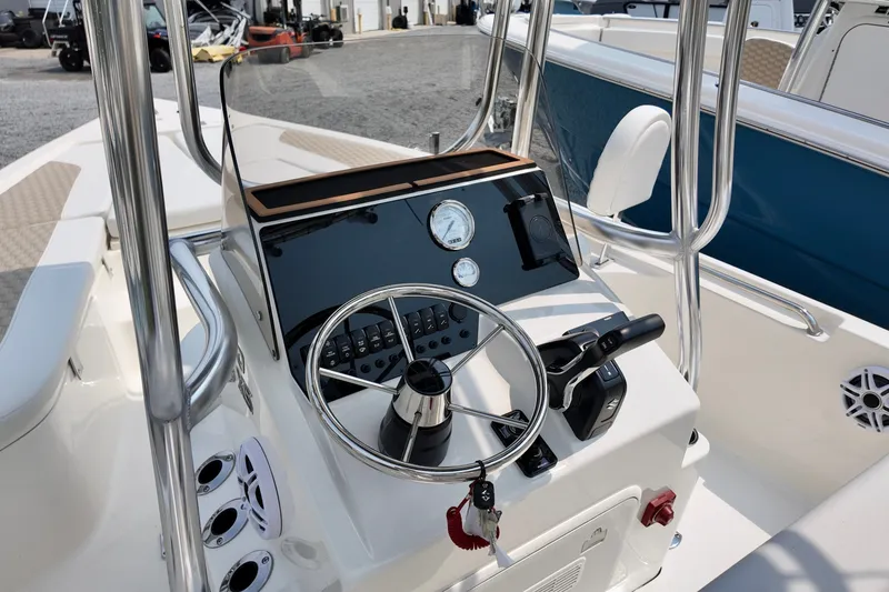 Slide: The Image of 2027 Bulls Bay 2200 XS boat console with steering wheel and controls. - 7