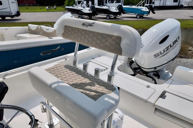 Slide: The Image of 2027 Bulls Bay 2200 XS boat with Suzuki engine, featuring stylish seating and modern design. - 8