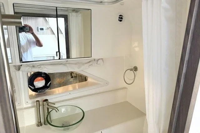 Slide: The Image of Modern bathroom interior of 2027 Sea Ray Sundancer 320 yacht with glass sink and mirror. - 15