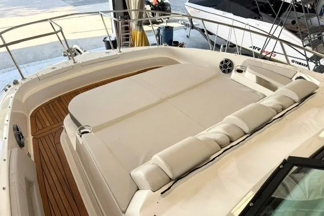 Slide: The Image of 2027 Sea Ray Sundancer 320 boat with spacious sun deck and luxurious seating. - 16