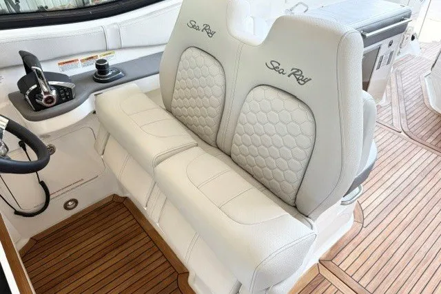 Slide: The Image of 2027 Sea Ray Sundancer 320 cockpit with luxurious seating and modern controls. - 17