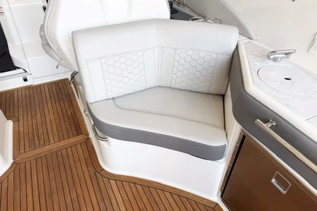 Slide: The Image of Luxurious seating area on 2027 Sea Ray Sundancer 320 yacht with elegant wood flooring. - 5