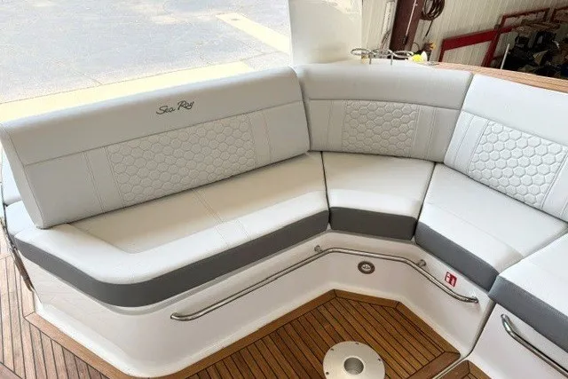 Slide: The Image of Luxurious seating on 2027 Sea Ray Sundancer 320 yacht with elegant design and wood flooring. - 8