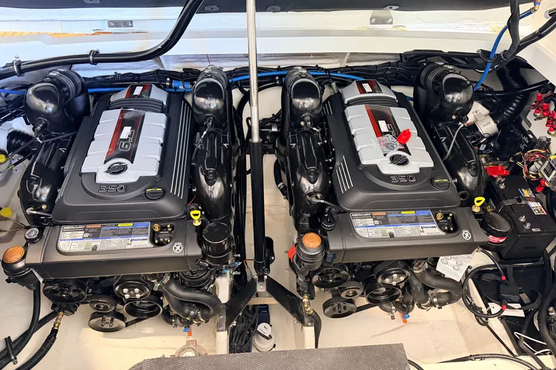 Slide: The Image of Twin engines in a 2027 Sea Ray Sundancer 320 boat, showcasing powerful performance. - 20