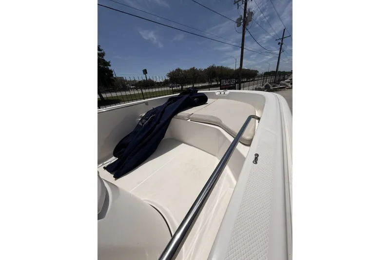 Slide: The Image of 2022 Boston Whaler 160 Super Sport boat interior with seating and railing. - 10