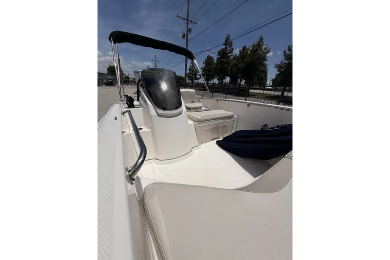 Slide: The Image of 2022 Boston Whaler 160 Super Sport boat with sleek design and spacious seating. - 11