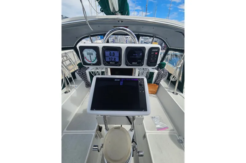 Slide: The Image of Cockpit of 1997 Valiant 42 sailboat with navigation instruments and steering wheel. - 4