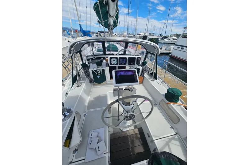 Slide: The Image of Cockpit of a 1997 Valiant 42 sailboat docked at a marina. - 5