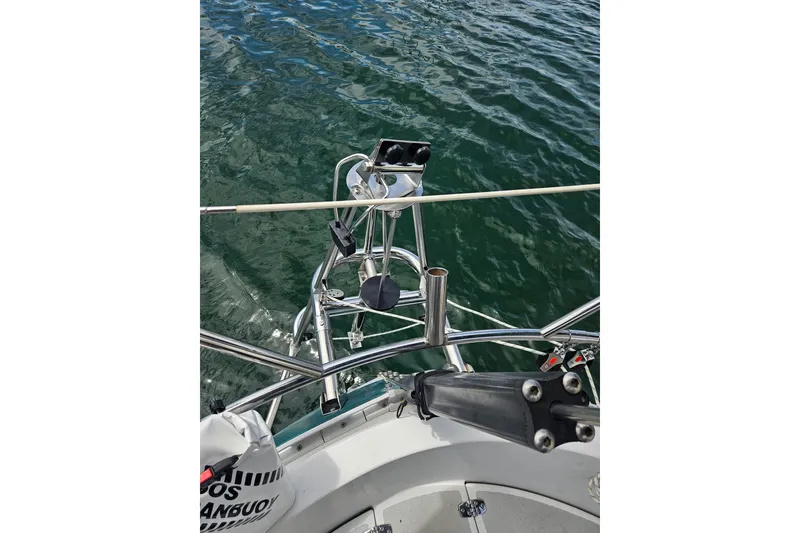 Slide: The Image of Sailboat deck view of a 1997 Valiant 42 on calm water. - 16