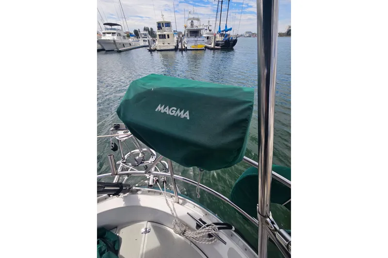 Slide: The Image of Boat deck with Magma grill cover, Valiant 42, 1997, docked in marina. - 17