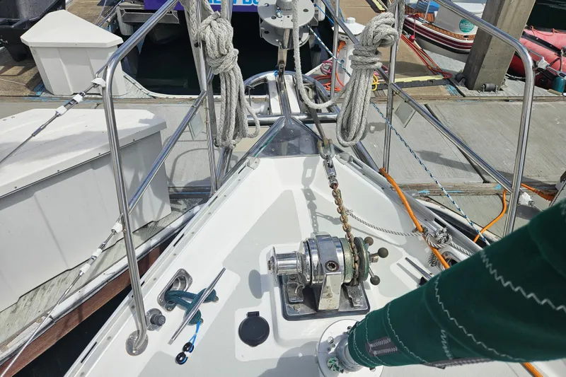 Slide: The Image of Bow of a 1997 Valiant 42 sailboat with anchor chain and ropes. - 20