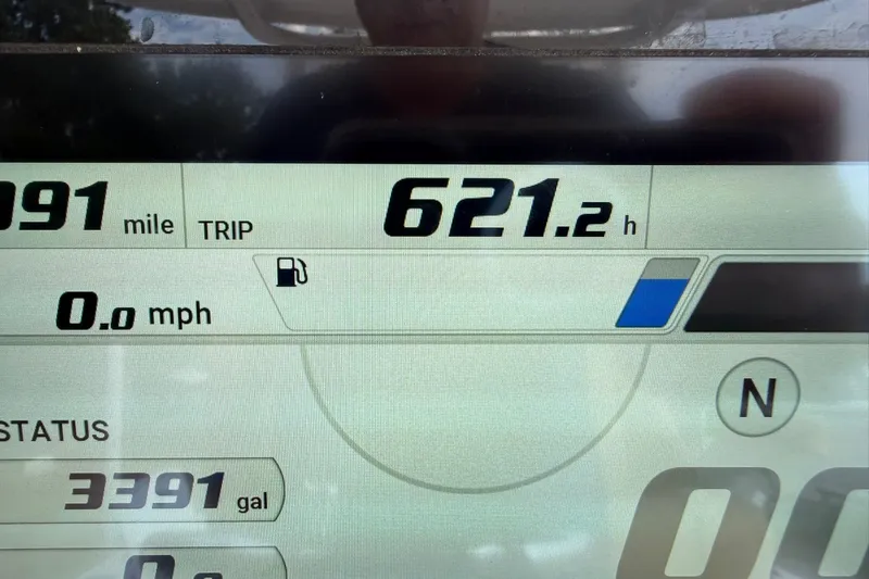 Slide: The Image of Dashboard display of a 2022 Sportsman Masters 247OE Bay Boat showing trip data. - 13
