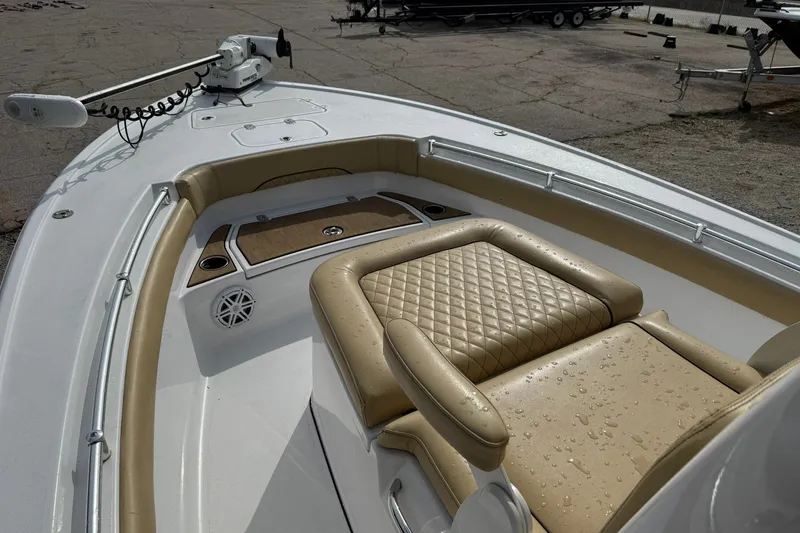 Slide: The Image of 2022 Sportsman Masters 247OE Bay Boat with tan seating and trolling motor. - 8