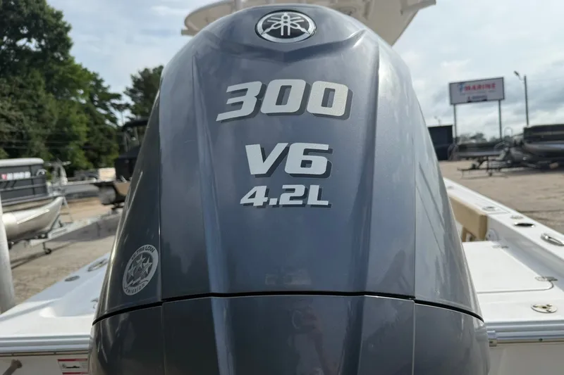 Slide: The Image of Outboard motor on 2022 Sportsman Masters 247OE Bay Boat, 300 V6 4.2L engine. - 4