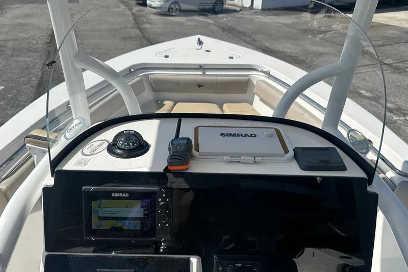 Slide: The Image of 2021 Sea Pro 219 Center Console boat dashboard with navigation equipment and controls. - 27