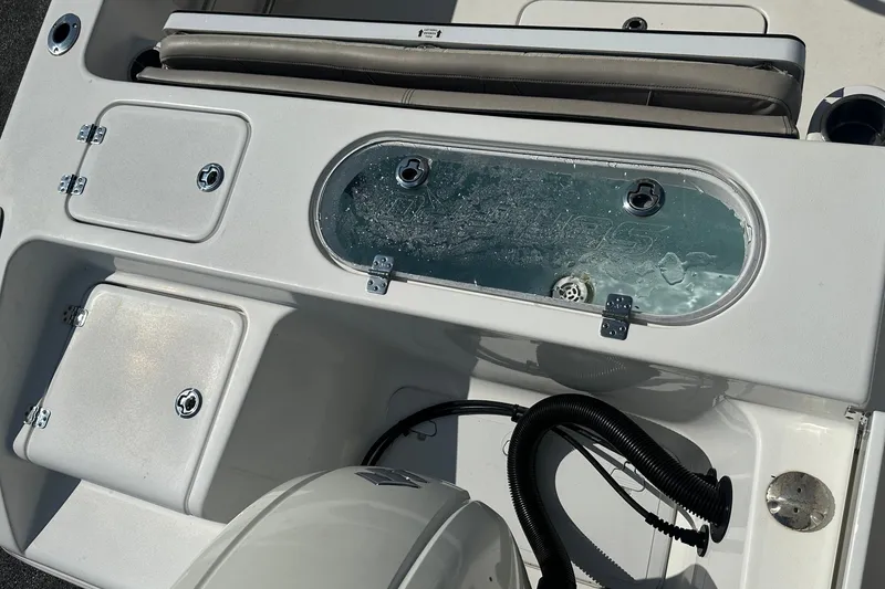 Slide: The Image of 2021 Sea Pro 219 Center Console boat with livewell and storage compartments. - 14