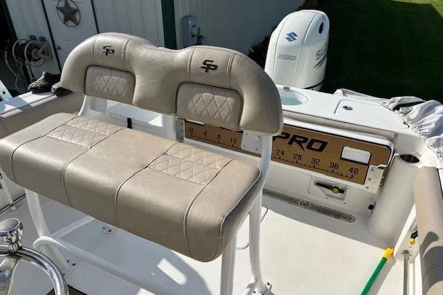 Slide: The Image of 2021 Sea Pro 219 Center Console boat with beige seating and Suzuki engine. - 4