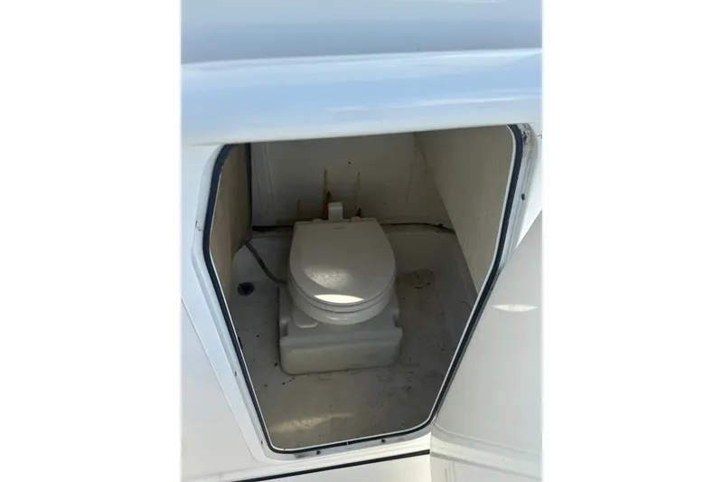 Slide: The Image of 2021 Sea Pro 219 Center Console boat toilet compartment interior view. - 29
