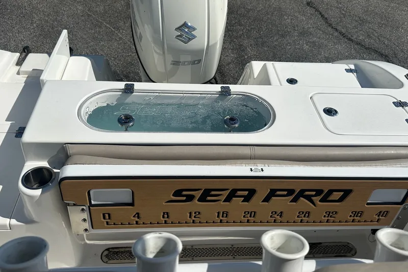 Slide: The Image of 2021 Sea Pro 219 Center Console boat with Suzuki 200 engine, featuring livewell and measuring board. - 12