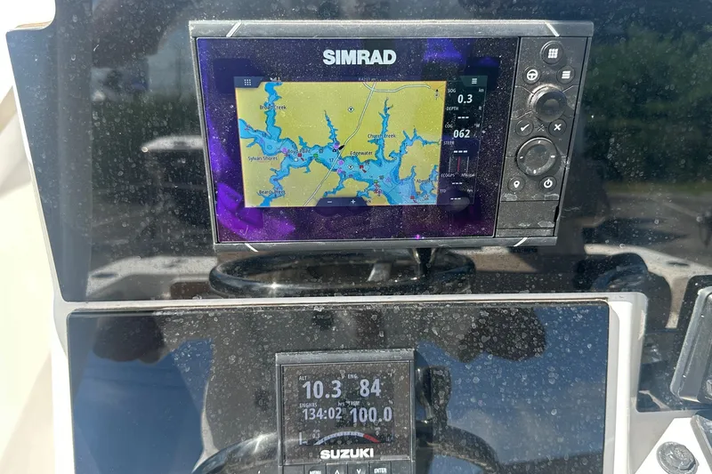 Slide: The Image of Simrad navigation display on 2021 Sea Pro 219 Center Console boat dashboard. - 28
