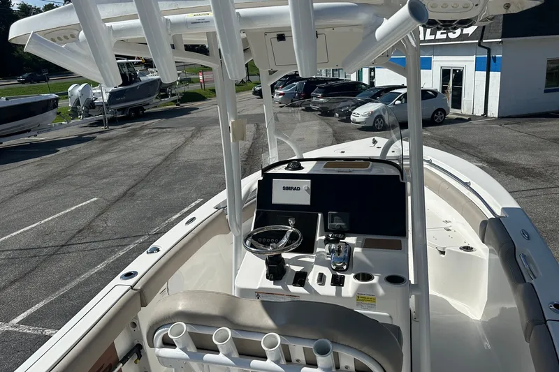 Slide: The Image of 2021 Sea Pro 219 Center Console boat interior with steering wheel and controls. - 21