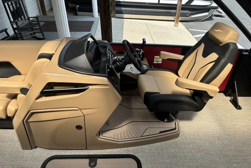 Slide: The Image of 2027 Evotti 723CS boat interior with beige and black captain's chair and dashboard. - 8