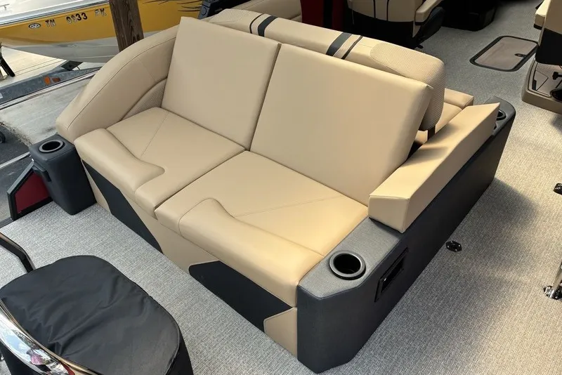 Slide: The Image of Luxurious beige seating on a 2027 Evotti 723CS boat, featuring integrated cup holders. - 9