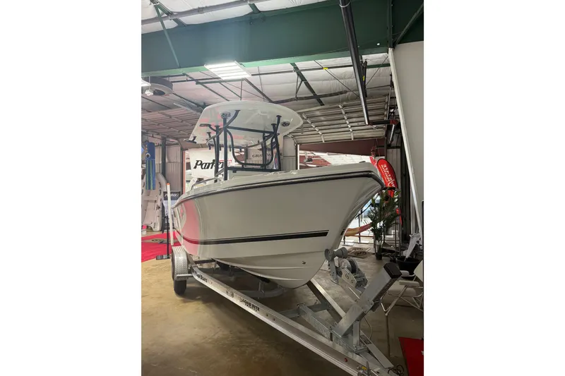 Slide: The Image of 2027 Parker 220 Coastal Elite boat on trailer in indoor showroom. - 6