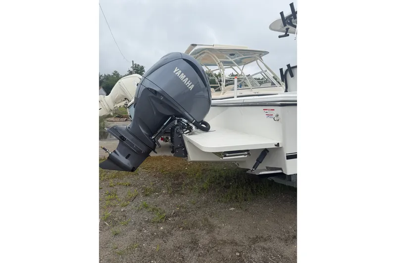 Slide: The Image of 2027 Parker 220 Coastal Elite boat with Yamaha outboard motor. - 4