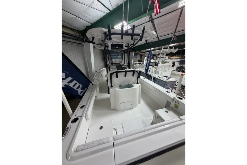 Slide: The Image of 2027 Parker 220 Coastal Elite boat interior, featuring spacious deck and modern amenities. - 9