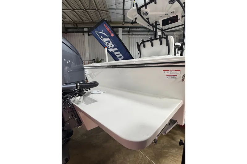 Slide: The Image of 2027 Parker 220 Coastal Elite boat with Yamaha engine in showroom. - 8