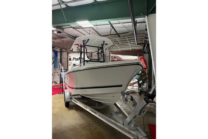 Slide: The Image of 2027 Parker 220 Coastal Elite boat on trailer in indoor showroom. - 7