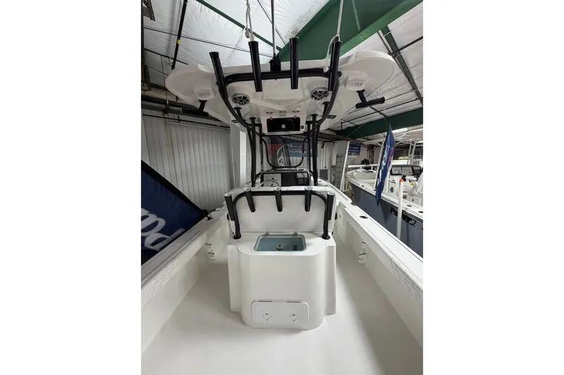 Slide: The Image of 2027 Parker 220 Coastal Elite boat interior with modern helm and storage features. - 10