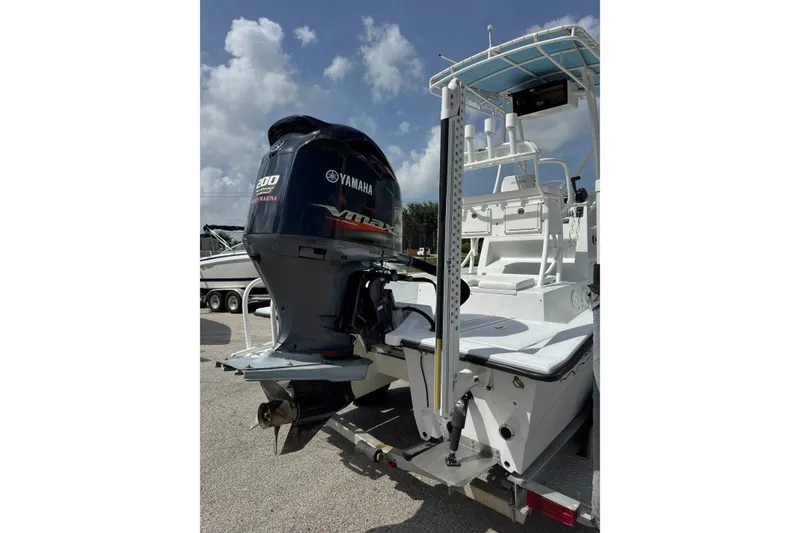 Slide: The Image of 2012 Shallow Sport 21 Modified V boat with Yamaha outboard motor, parked on a trailer. - 5