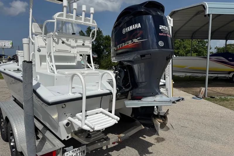 Slide: The Image of 2012 Shallow Sport 21 Modified V boat with Yamaha outboard motor on trailer. - 3