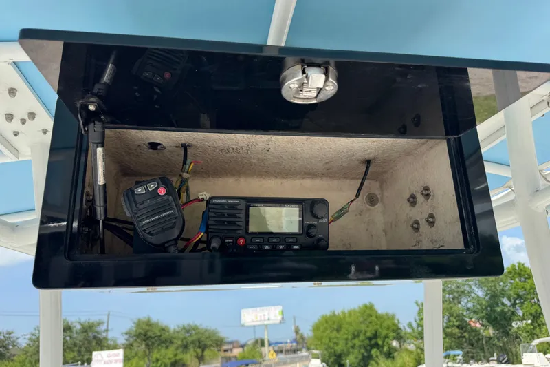Slide: The Image of 2012 Shallow Sport 21 Modified V boat console with radio equipment and wiring. - 24