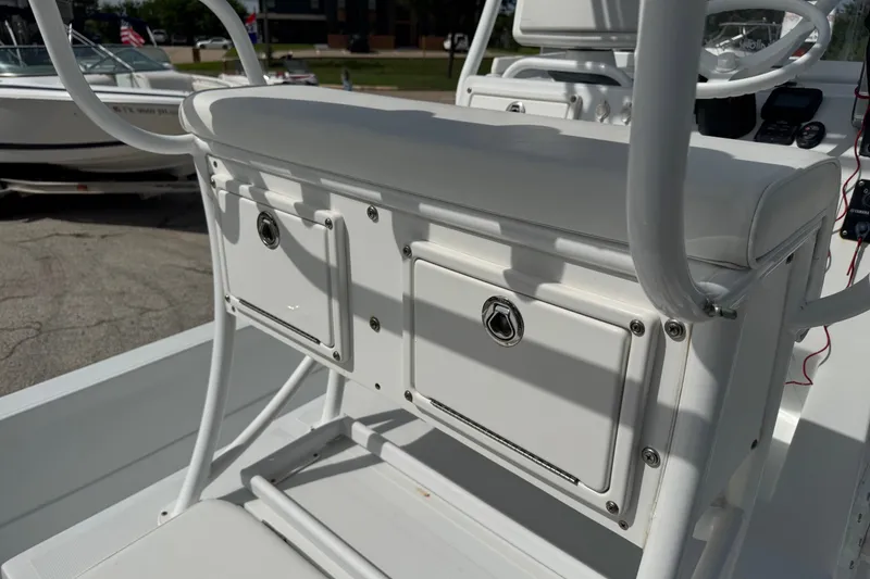 Slide: The Image of 2012 Shallow Sport 21 Modified V boat console with storage compartments and seating. - 13