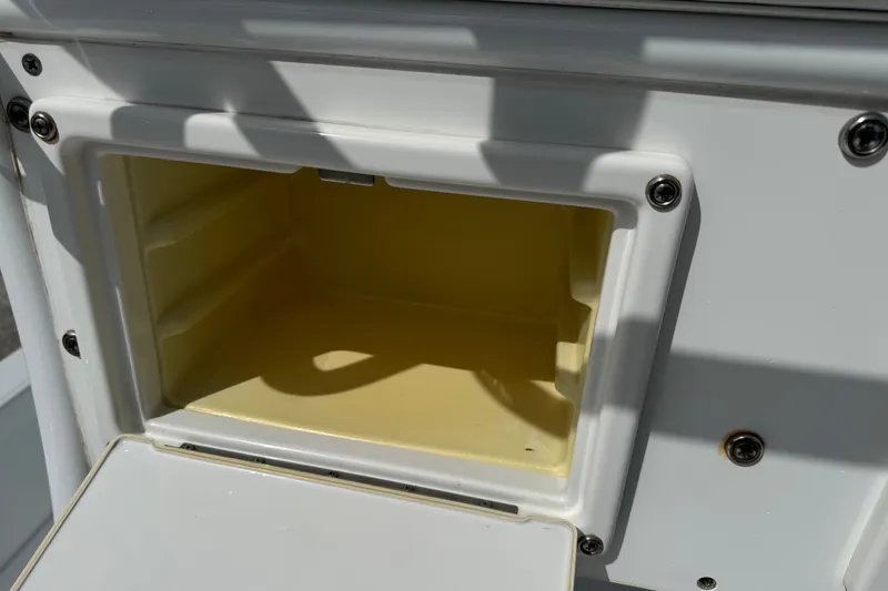 Slide: The Image of Open storage compartment on a 2012 Shallow Sport 21 Modified V boat. - 16
