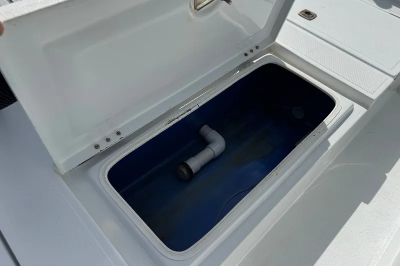 Slide: The Image of Open storage compartment on a 2012 Shallow Sport 21 Modified V boat. - 9