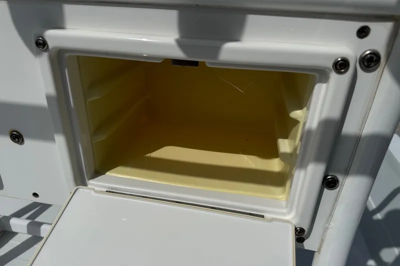 Slide: The Image of Open storage compartment on a 2012 Shallow Sport 21 Modified V boat. - 15